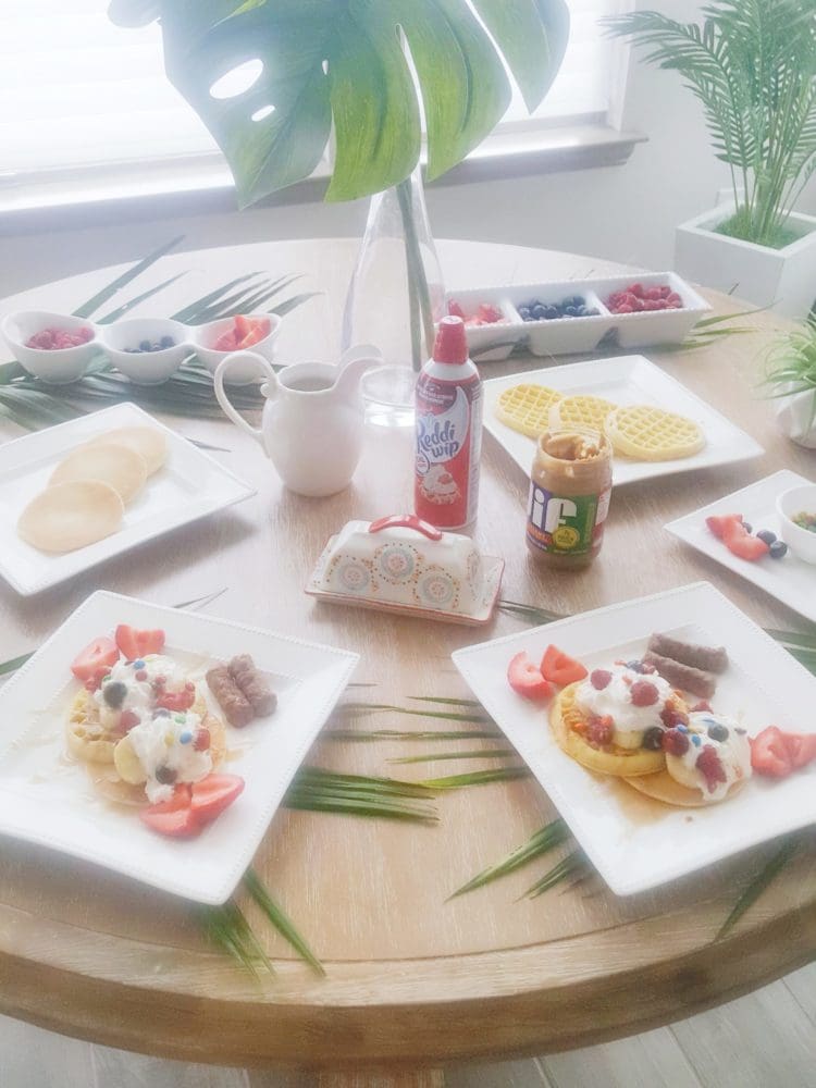 waffle bar and pancake bar with fruit toppings whip cream peanut butter and m&ms