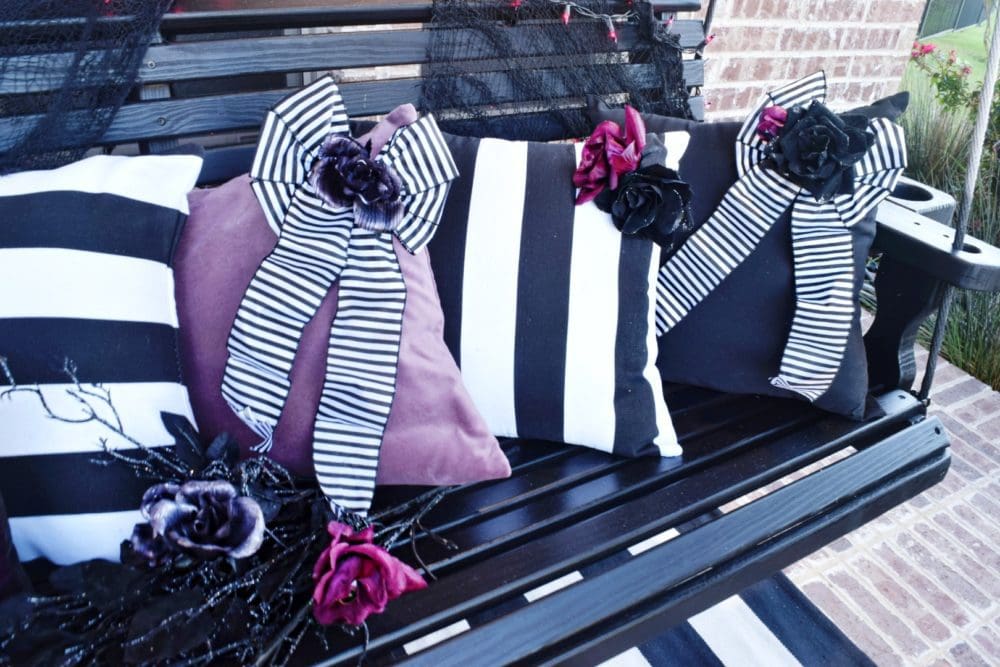 Frightful front porch modern chic halloween decorating ideas DIY flower embellishments DIY bow embellishments for pillows modern Halloween pillows