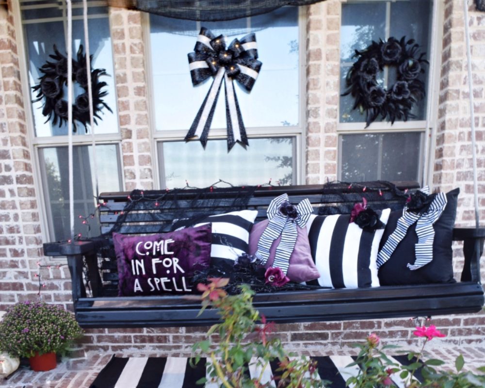 Frightful front porch Halloween decorating ideas modern Halloween decor chic Halloween black and white stripes