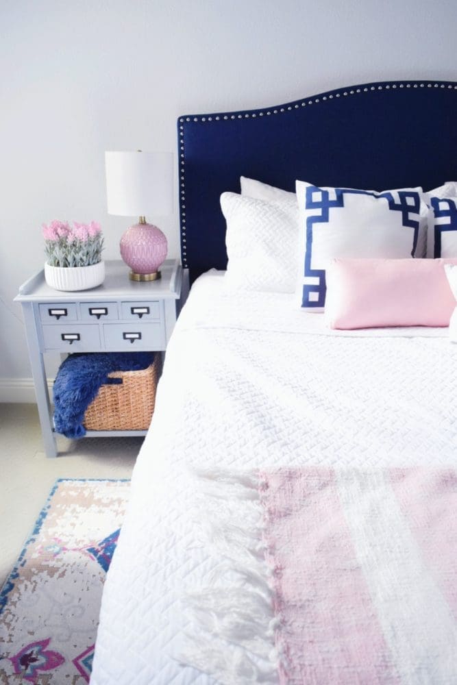 Modern Elegance Guest Bedroom Design ideas using navy and blush modern color palettes for guest bedroom decor ideas vintage bedroom rug with white bedding and greek key throw pillows