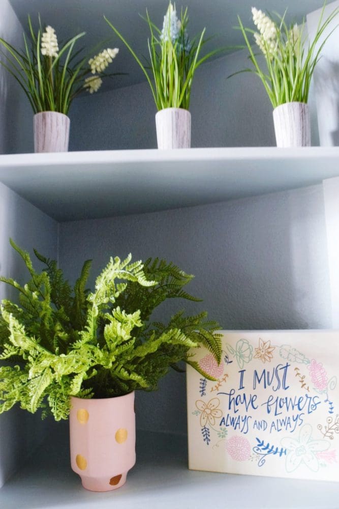 spring home decor ideas for your entryway with faux plants and flowers