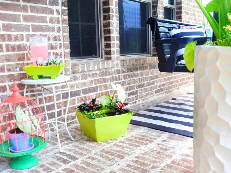 front porch with colorful furniture and plants