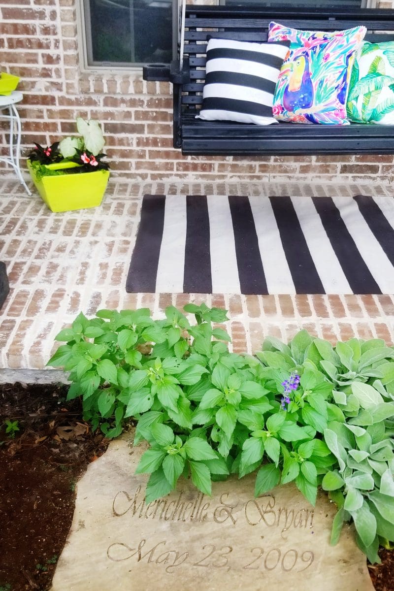 front porch swing with engraved wedding stone