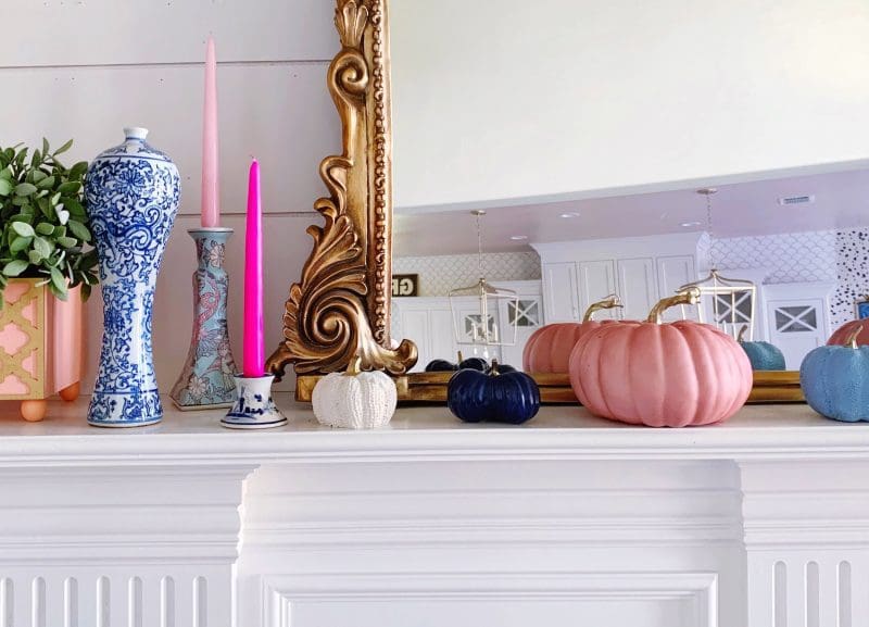 modern fall mantle with pink pumpkins pink taper candles and chinoiserie vase