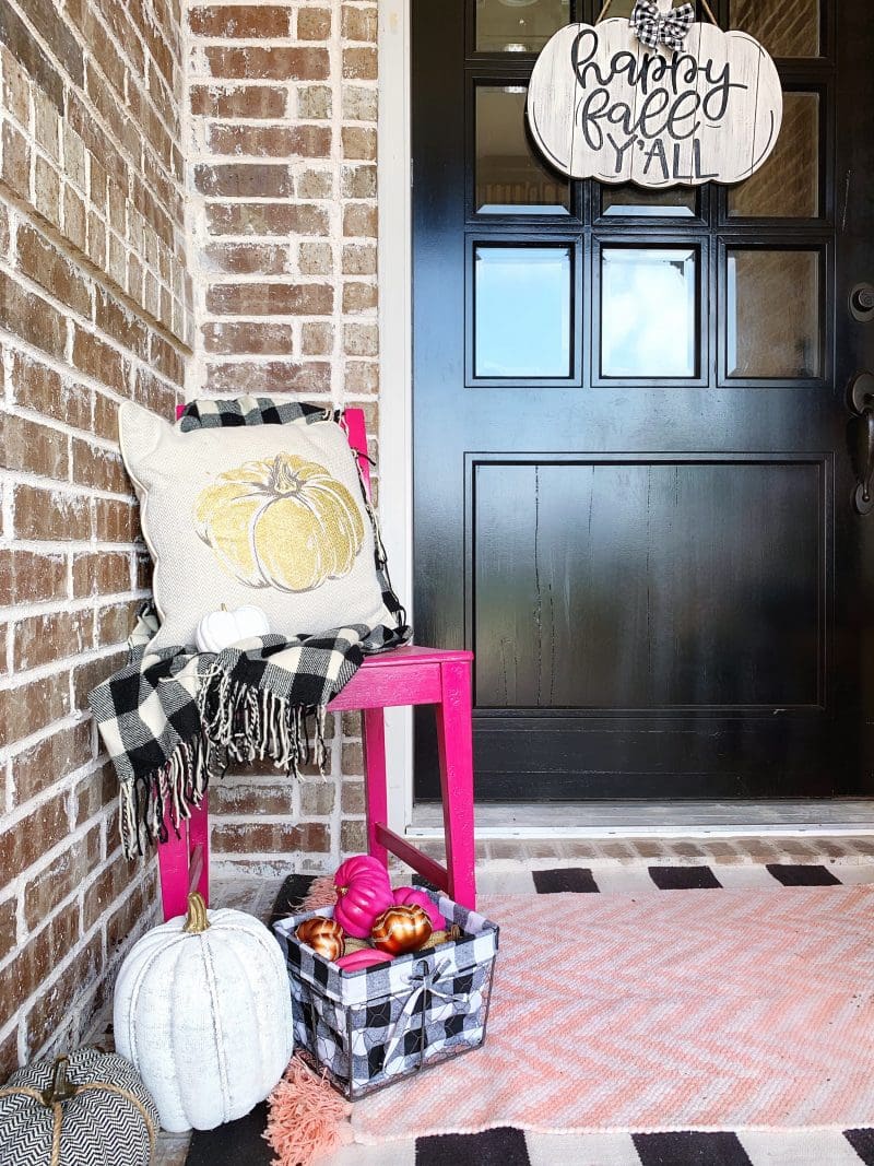 colorful fall front porch with black and white buffalo check