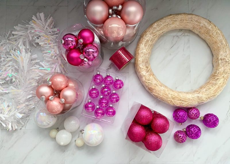 pink christmas ornaments and wreath 