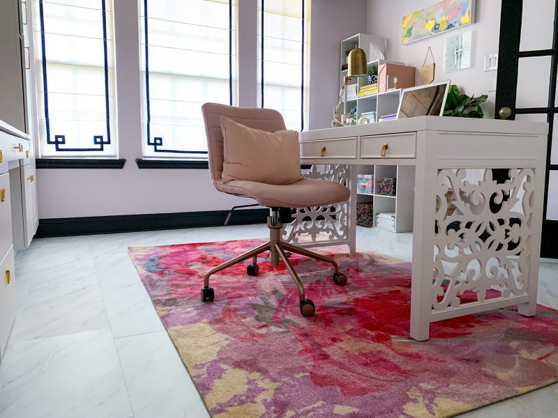 pink floral rug white modern desk in home office