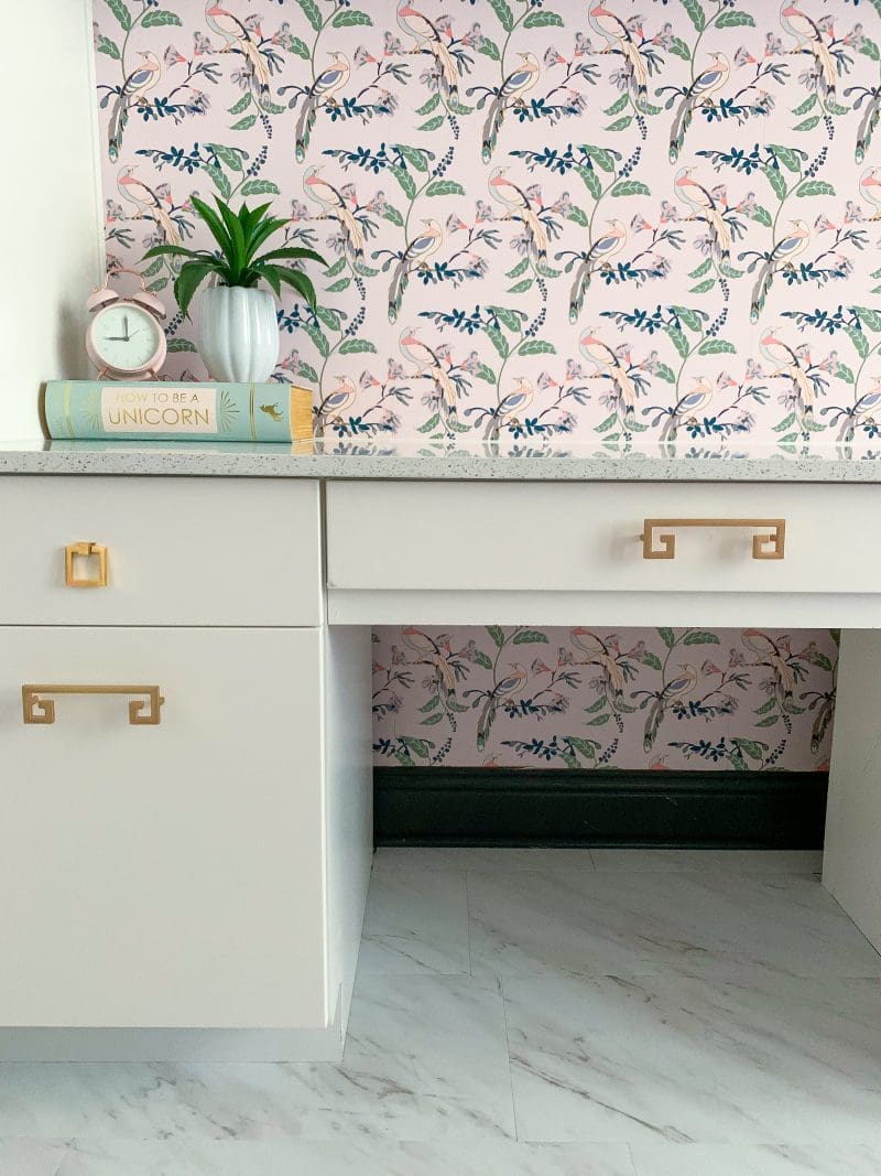 white cabinets with brass hardware pink chinoiserie wallpaper