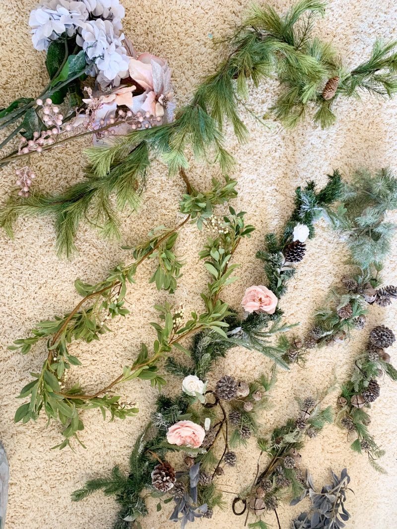 christmas garland and christmas floral stems for holiday mantel