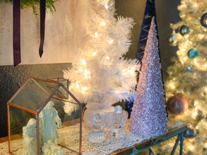 christmas tree and manger scene on entryway table