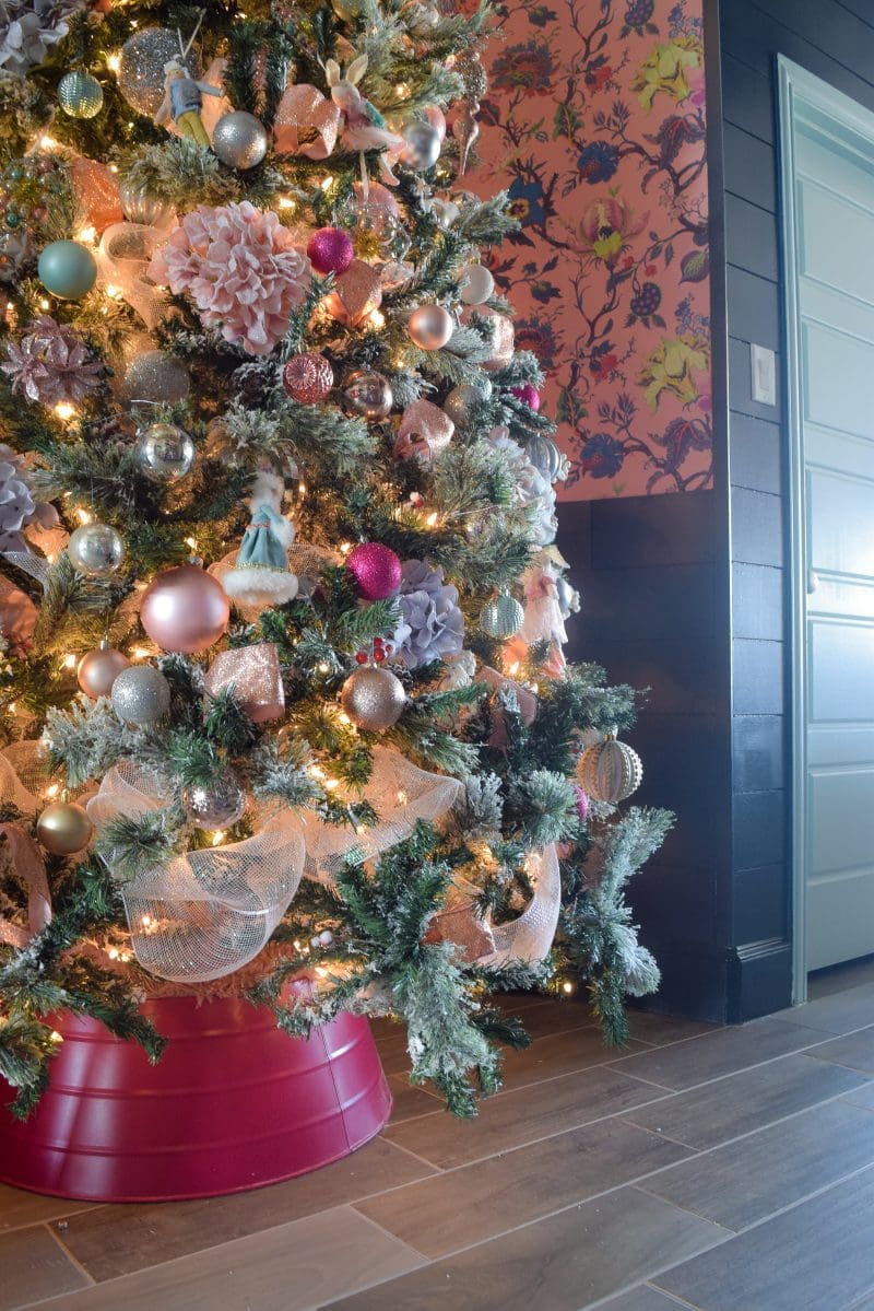 christmas tree with pink white blue christmas ornaments and pink tree collar