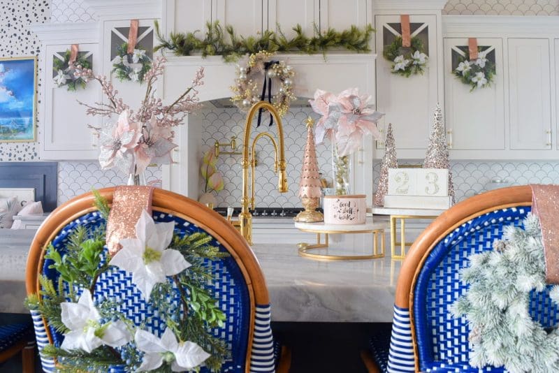 Modern kitchen decorated for Christmas in blush pink and gold