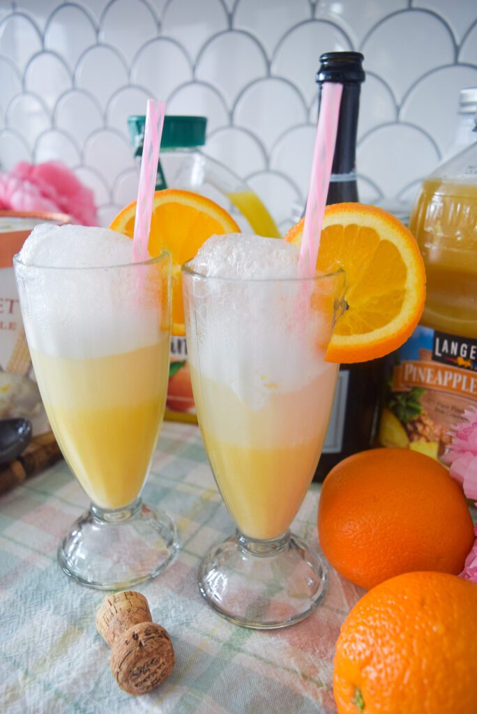 Pineapple Orange Sherbet Mimosa recipe with orange juice, prosecco, pineapple juice, and pineapple sherbet