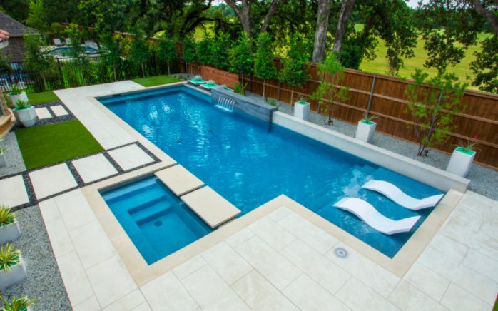 modern pool rectangle shape with in level hot tub tanning ledge and rectangle step pads